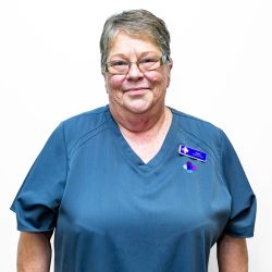 Headshot of Nurse Helen Gurney at Bremer Medical Centre wearing blue scrubs and name tag.